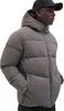 A man wearing a puffer jacket and a cap. Produktbild-Vorschau
