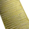 A sheet of gold stickers with embossed letters and numbers. Produktbild-Vorschau