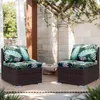 Two outdoor chairs with tropical leaf patterned cushions on a patio. Náhled obrázku produktu