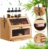 A bamboo bread box with jars on top and bread inside, surrounded by bamboo leaves. Produktbild-Vorschau