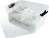 A clear plastic storage box with a lid, containing folded textiles with a dotted pattern. Produktbild-Vorschau