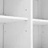Close-up view of the interior of a white cabinet or shelving unit, showing pre-drilled holes for shelf placement. Anteprima dell’immagine prodotto
