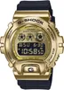 A close-up studio shot of a gold Casio G-Shock digital watch with a black band. Podgląd zdjęcia produktu