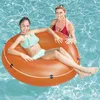 Two women in a swimming pool, one sitting in an orange inflatable ring. Náhľad obrázku produktu