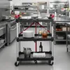 A commercial kitchen setting with stainless steel appliances and shelves. Voir les images du produit