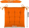 An orange seat cushion is shown from above, with dimensions indicated. Produktbild-Vorschau