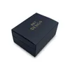A dark blue gift box with gold lettering. Produktbild-Vorschau
