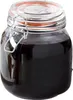 A glass jar filled with a dark liquid, sealed with a wire bail lid. Produktbild-Vorschau