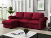 A red sectional sofa is shown in a living room setting with a coffee table in the foreground. Náhľad obrázku produktu