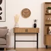 A living room scene with a console table, clock, vase, and sofa. Náhled obrázku produktu