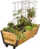 A wooden raised garden bed with various plants, including tomatoes and lettuce, growing inside. The garden bed is on wheels. Anteprima dell’immagine prodotto