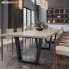 A dining room setting with a long table and chairs, featuring a bonsai tree as a centerpiece. Produktbild-Vorschau