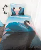 A bed with bedding featuring a swan print. Podgląd zdjęcia produktu