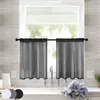 A kitchen sink area with black sheer bistro curtains hanging over the window. Produktbild-Vorschau
