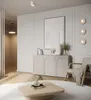 A minimalist living room scene with a sideboard, armchair, and coffee table. Produktbild-Vorschau