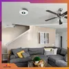 A living room with a sectional sofa, coffee table, and a smoke detector on the ceiling. Podgląd zdjęcia produktu