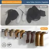 The image shows a before and after comparison of how boots are stored. The top panel shows boots folded and possibly creased, while the bottom panel shows boots stored upright on a rack, preventing creases and allowing air circulation. Produktbild-Vorschau