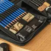 A close-up view of an art supply case, showing pencils, charcoal sticks, and a small box of charcoal. Podgląd zdjęcia produktu