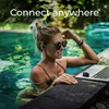 A woman is working on a laptop in a swimming pool. Náhľad obrázku produktu