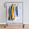 A clothing rack with several garments hanging on it. Anteprima dell’immagine prodotto