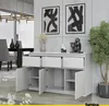 A white sideboard with drawers and doors open, displayed in a modern dining room setting with artwork on the wall and a plant. Produktbild-Vorschau