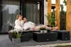 A couple relaxing on a patio furniture set. Náhled obrázku produktu