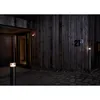 A modern house entrance at night, illuminated by outdoor lights. Produktbild-Vorschau