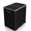 A black dual-compartment trash can with silver pedals and trim, shown from a 3/4 front angle on a white background. Produktbild-Vorschau