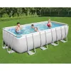 A family is enjoying a rectangular above-ground swimming pool in a grassy backyard. Produktbild-Vorschau