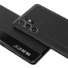 A black phone case with a clear window is shown from a diagonal angle, with the camera array visible. Produktbild-Vorschau