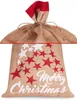 A close-up view of a Christmas sack made of burlap, decorated with red and white stars and the text 'Merry Christmas'. Produktbild-Vorschau
