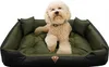 A dog is lying on a green and black dog bed. Podgląd zdjęcia produktu