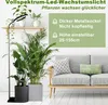 A grow light illuminating plants next to a sofa. Produktbild-Vorschau