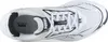 A top-down view of a white Puma sneaker with black accents. Voir les images du produit