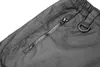 A close-up view of a gray fabric with a zipper pocket and a D-ring. Anteprima dell’immagine prodotto