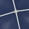 A close-up view of a white plastic connector piece with four white poles extending from it, attached to a blue tarp-like material. Náhled obrázku produktu