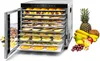 A food dehydrator with multiple trays filled with dried fruits and herbs, surrounded by fresh fruits and nuts. Anteprima dell’immagine prodotto