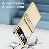 A gold phone case is shown in a dynamic pose, appearing to fall and crack the ground beneath it, with blue stairs in the background. Produktbild-Vorschau