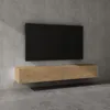 A modern wall-mounted TV stand with a black television above it, set against a concrete wall. Anteprima dell’immagine prodotto