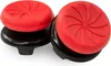 Two red and black thumbstick grips for a gaming controller. Produktbild-Vorschau