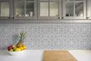 A kitchen counter with a backsplash and cabinets. Produktbild-Vorschau
