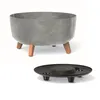 A grey planter with wooden legs and a black insert are shown against a white background. Náhľad obrázku produktu