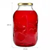 A glass jar filled with red liquid, featuring embossed fruit designs and measurement indicators. Podgląd zdjęcia produktu