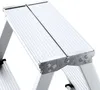 A close-up view of the top steps of a silver aluminum stepladder. Produktbild-Vorschau
