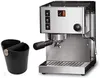 A stainless steel espresso machine and a black knock box are shown against a white background. Produktbild-Vorschau