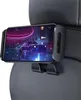 A smartphone is mounted on a car seat headrest using a black holder, displaying a neon-lit cityscape with a car. Anteprima dell’immagine prodotto