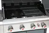 A close-up view of the top section of a gas grill, showing the cooking grates and control knobs. Anteprima dell’immagine prodotto