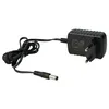 A black power adapter with a coiled cord and a barrel connector. Produktbild-Vorschau