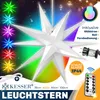 A large, white, 3D star-shaped light fixture with colorful lights emanating from it, set against a dark, speckled background. Small star-shaped lights in various colors are arranged on the left side of the image. Text and icons indicating features and spec Produktbild-Vorschau