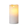 A white LED candle with a flickering flame. Produktbild-Vorschau